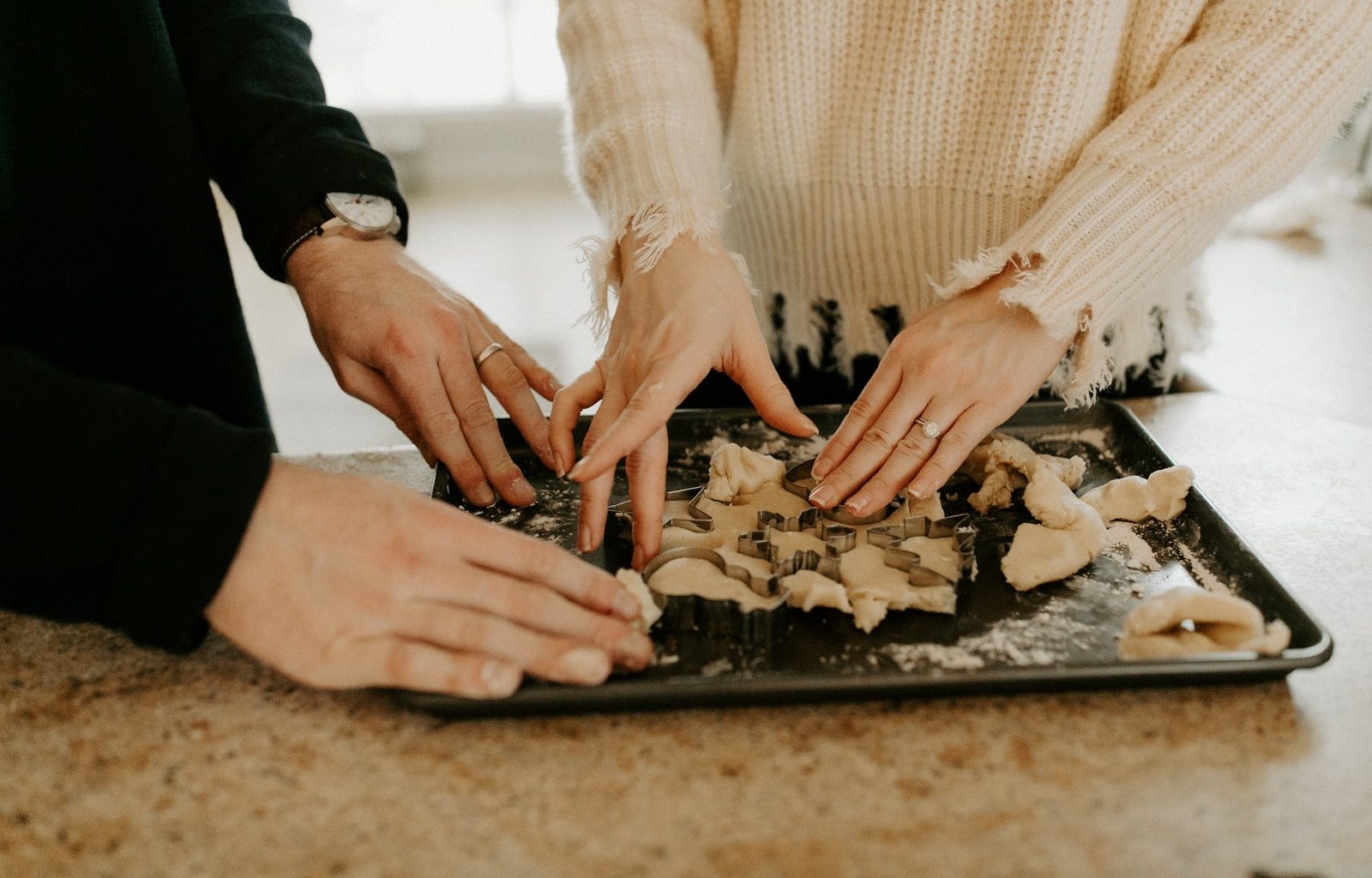 shallow focus photo of person touching black tray