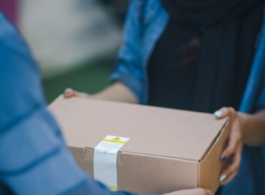 person giving brown box
