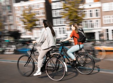 two women riding bicycles