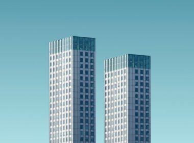 two teal-and-white skyscrapers