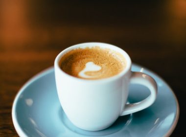 selective focus photography of latte in teacup