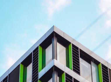 green and white concrete building under blue sky during daytime