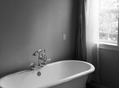 white ceramic bath tub inside room