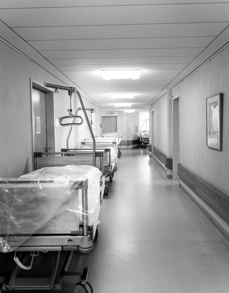 white hospital bed in a room